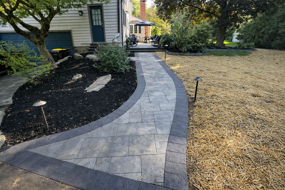 Custom Patio & Fire Pit Installation Connecting Driveway, Rear Entry & Outdoor Living Areas