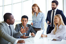 Team of five colleagues meeting for discussion.jpg
