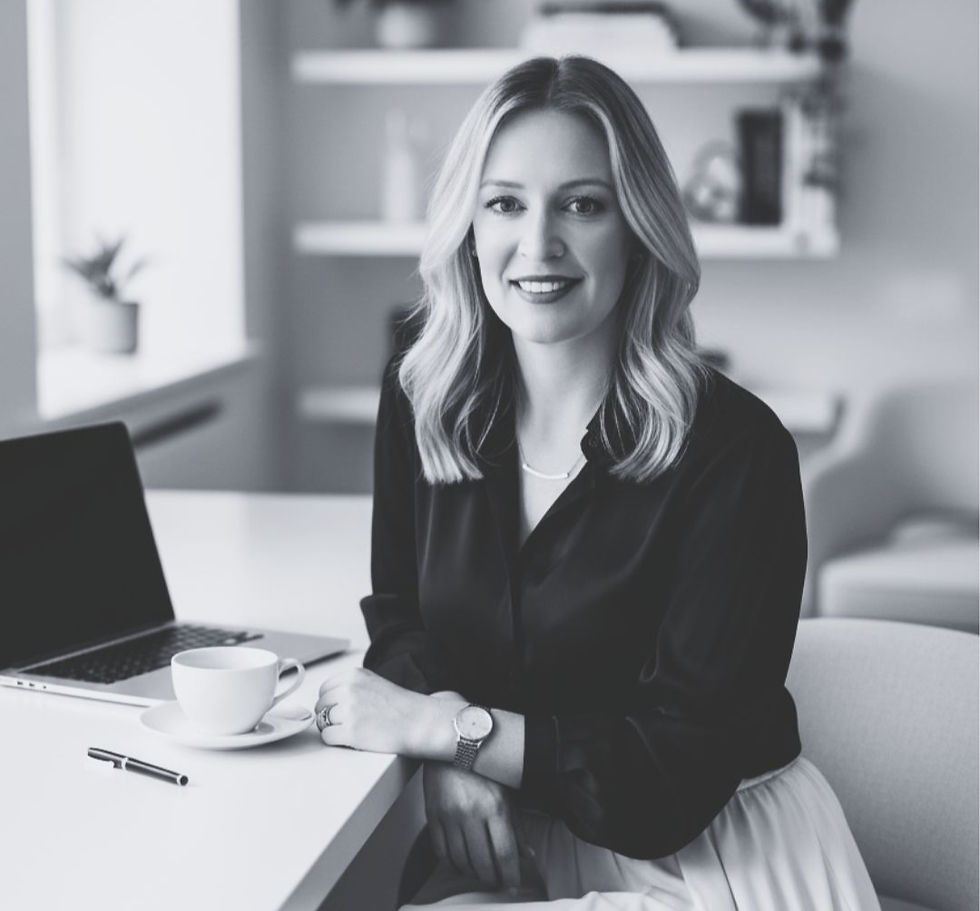 Agency Founder sat at desk with laptop and cup of tea