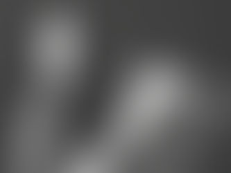 A person in a suit sits in a dimly lit room, reading a newspaper titled "The Experience Economy Has Evolved." The mood is serious.