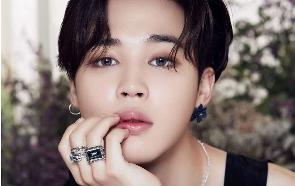 Jimin keeps is skin flawless with his face mask during long flights