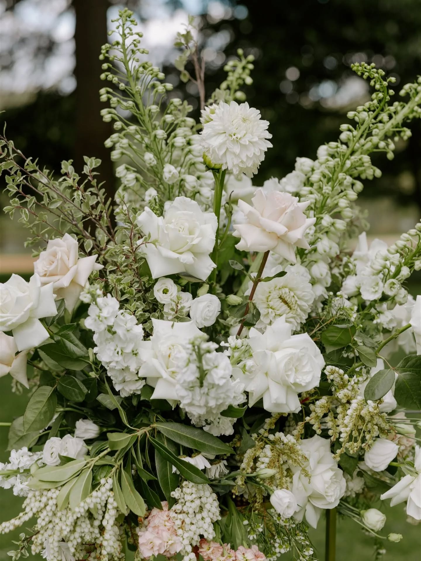 white and green flowers with pops of soft blush pink