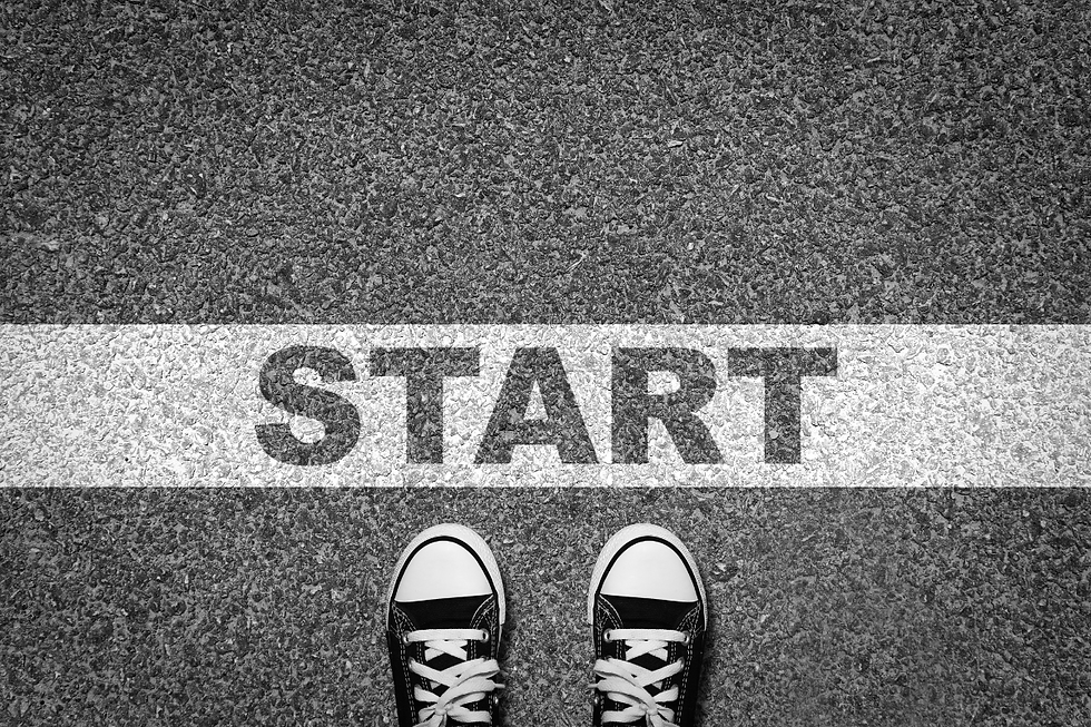 Birdseye view of Converse shoes stating at a start sign