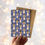 Thumbnail: A6 greetings card featuring a diverse mix of hand drawn straw angels against a frosted and starry night sky Kraft envelope