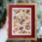 Art print featuring hand drawn Christmas desserts and snacks against a white background, red mount wooden frame