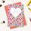 Thumbnail: greetings card with multi coloured hearts around a white heart with the words Only You, coral envelope