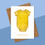 Thumbnail: white greetings card with yellow baby romper with sunshine pattern and congratulations text underneath, kraft envelope