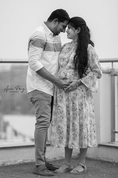 maternity photoshoot, couple photoshoot with white shirt and pink dress beautiful maternity, baby shower photography. monochrome, black and white photography
