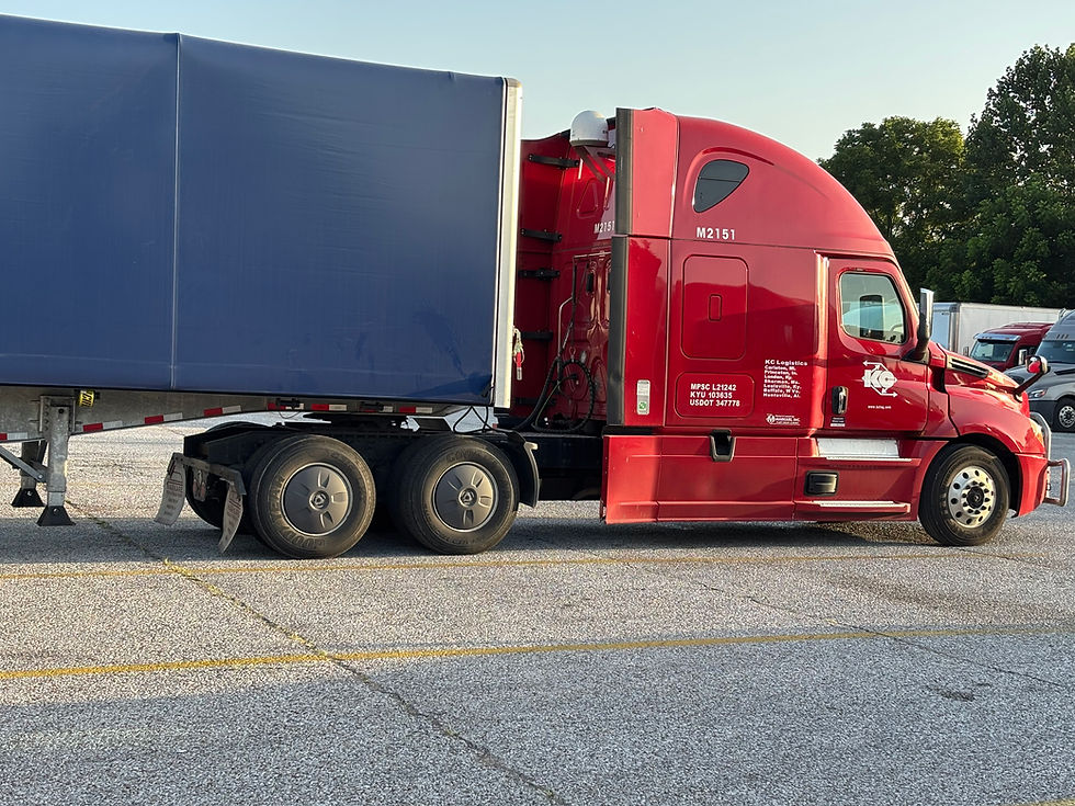 KC Logistics Truck Hauling One of the First Conestoga Loads