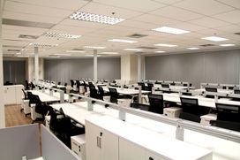 Large open office floor plan with high-capacity workstation layout.