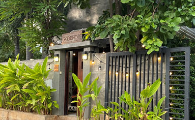Main entrance gate with landscaped greenery at Goodhope