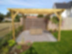 Softwood pergola over sandstone