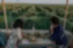 Couple enjoying dinner on the rooftop terrace overlooking olive groves at Riad Bab Agdal i