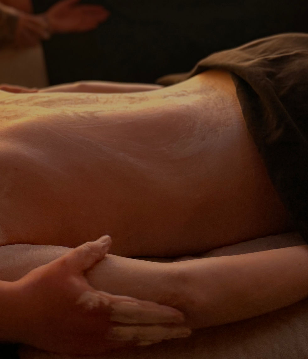 Close-up view of a calm spa room with soft lighting and massage table
