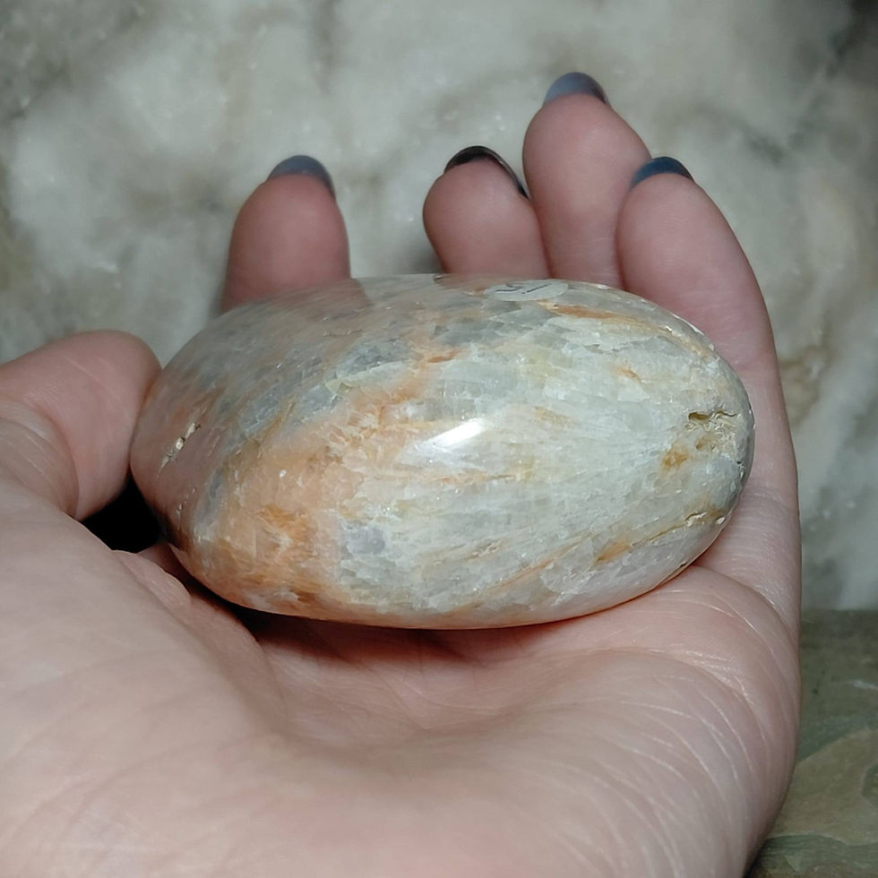 Thumbnail: celestobaryte pebble hand held side view