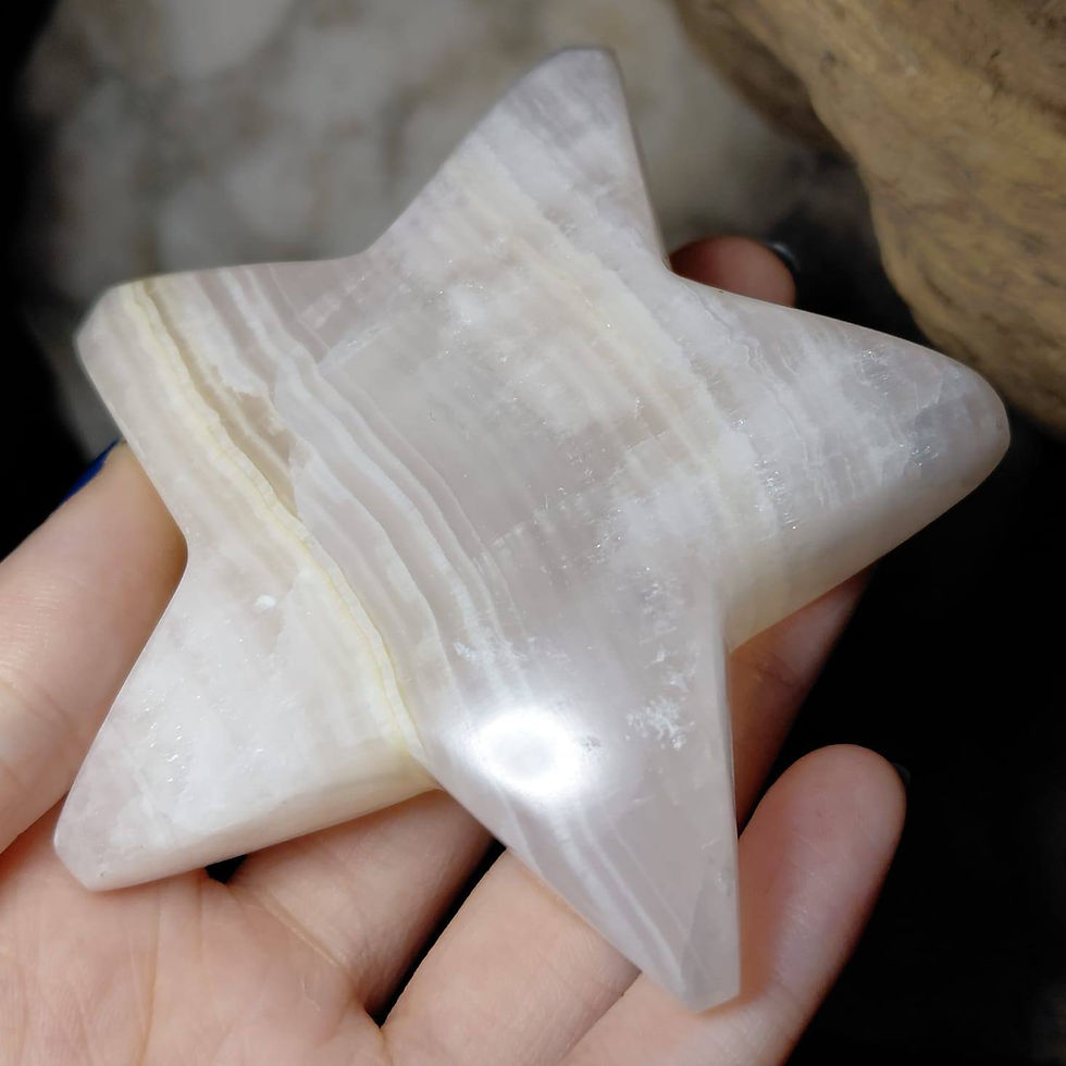 mangano calcite star side view hand held