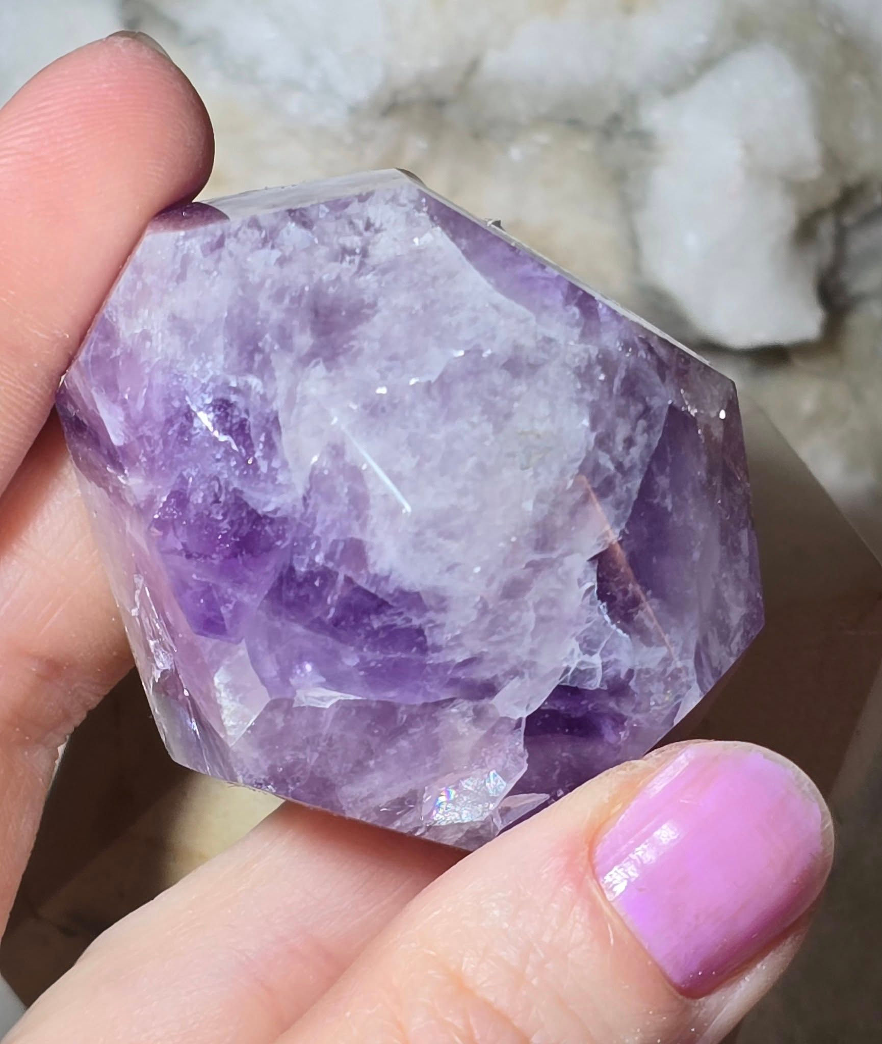 amethyst cut and polished shape hand held top view