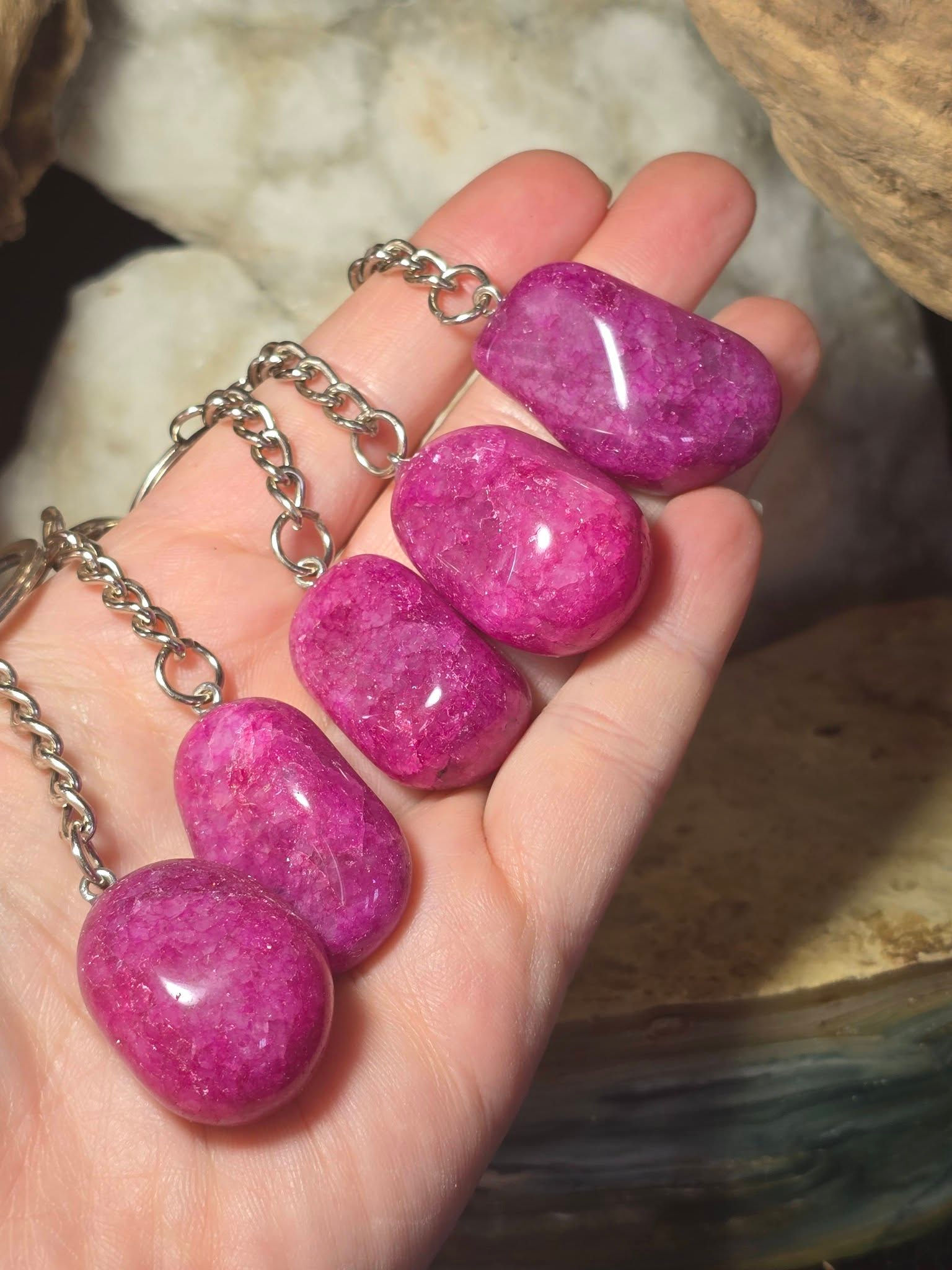 dyed pink quartz keyrings hand held side view