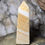 Thumbnail: banded orange calcite obelisk side view