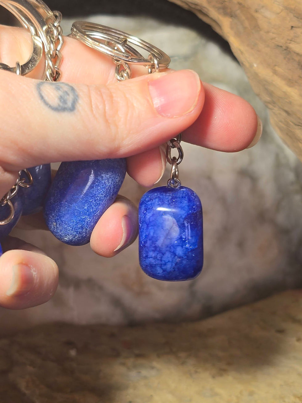Thumbnail: blue dyed quartz keyrings hand held side view