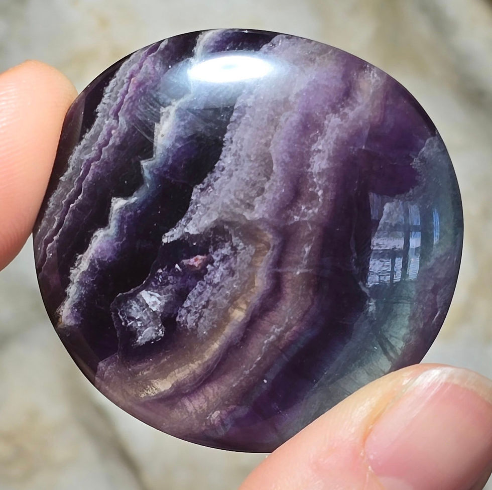 Thumbnail: rainbow fluorite palmstone hand held