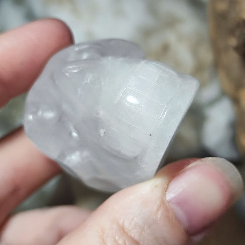 Thumbnail: quartz skull hand held front view