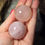 Thumbnail: two rose quartz spheres hand held