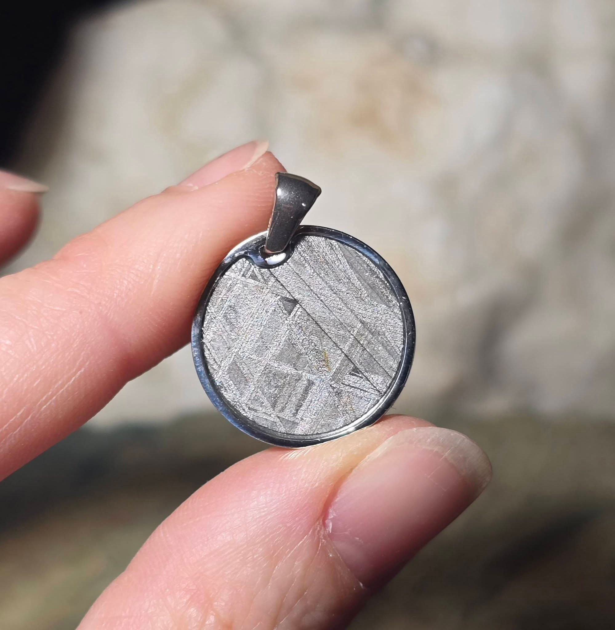 aletai meteorite pendant hand held front view