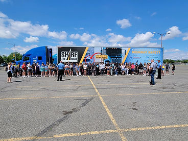 Share the Road semi with group of people standing in front