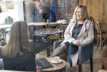 Rachel sat chatting to a potential client during a Marketing meeting.