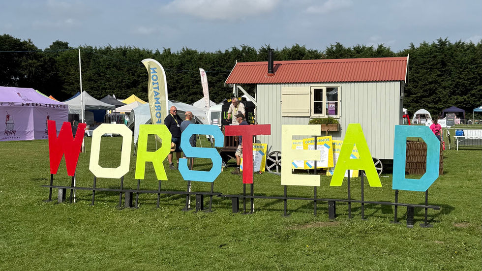 Worstead Festival coloured signage logo