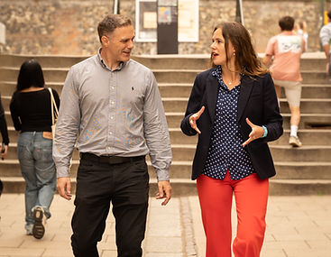 Rachel walking next to a potential Marketing client.
