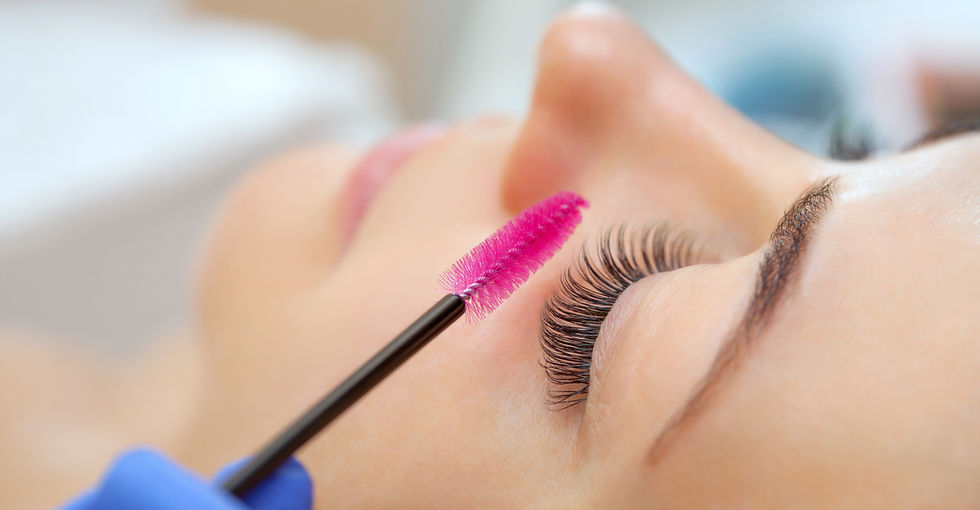Natural lashes being brushed after a lash lift at Wax N' Blush in Long Beach