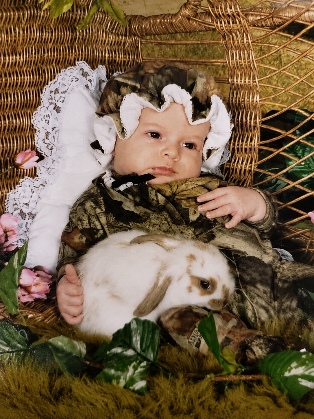 Bree as a baby holding a rabbit