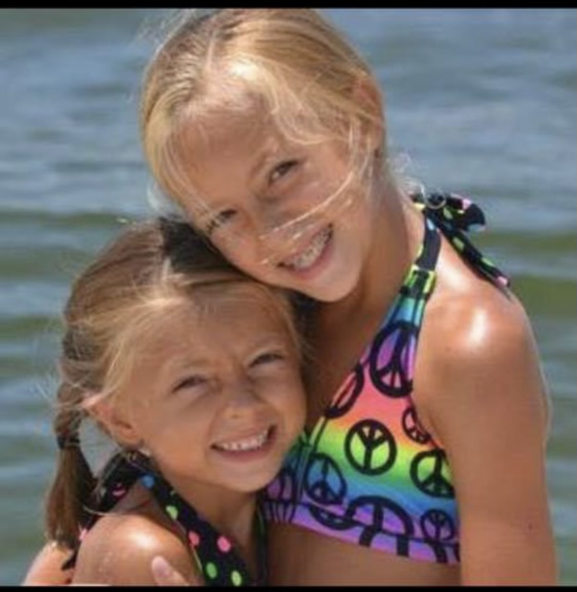 Bree and her sister Kirstin as children by the water