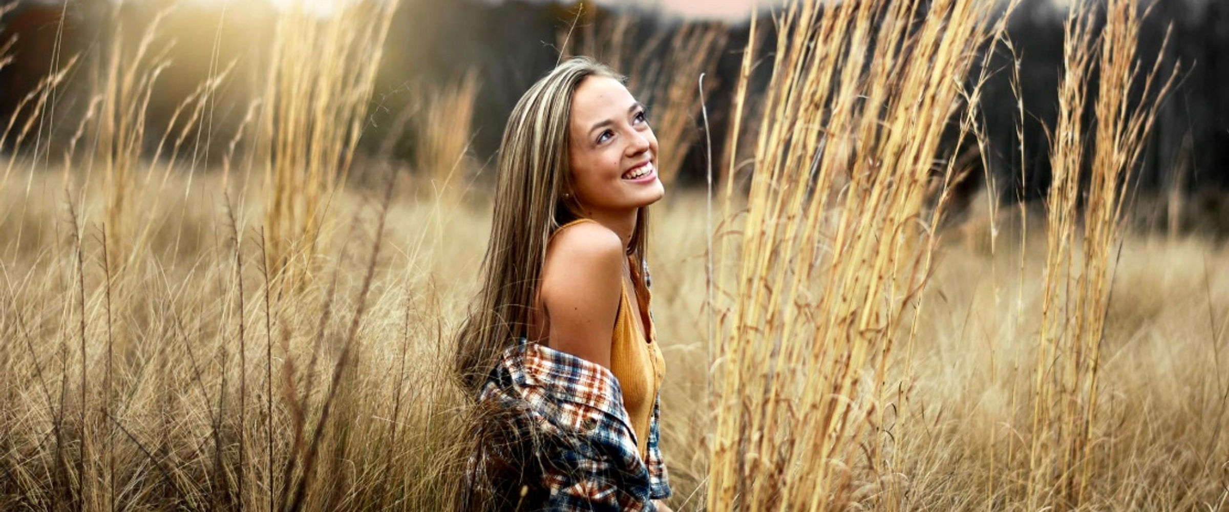 Bree smiling in a field
