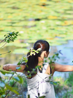a woman in a white dress is doing yoga_edited_edited.jpg
