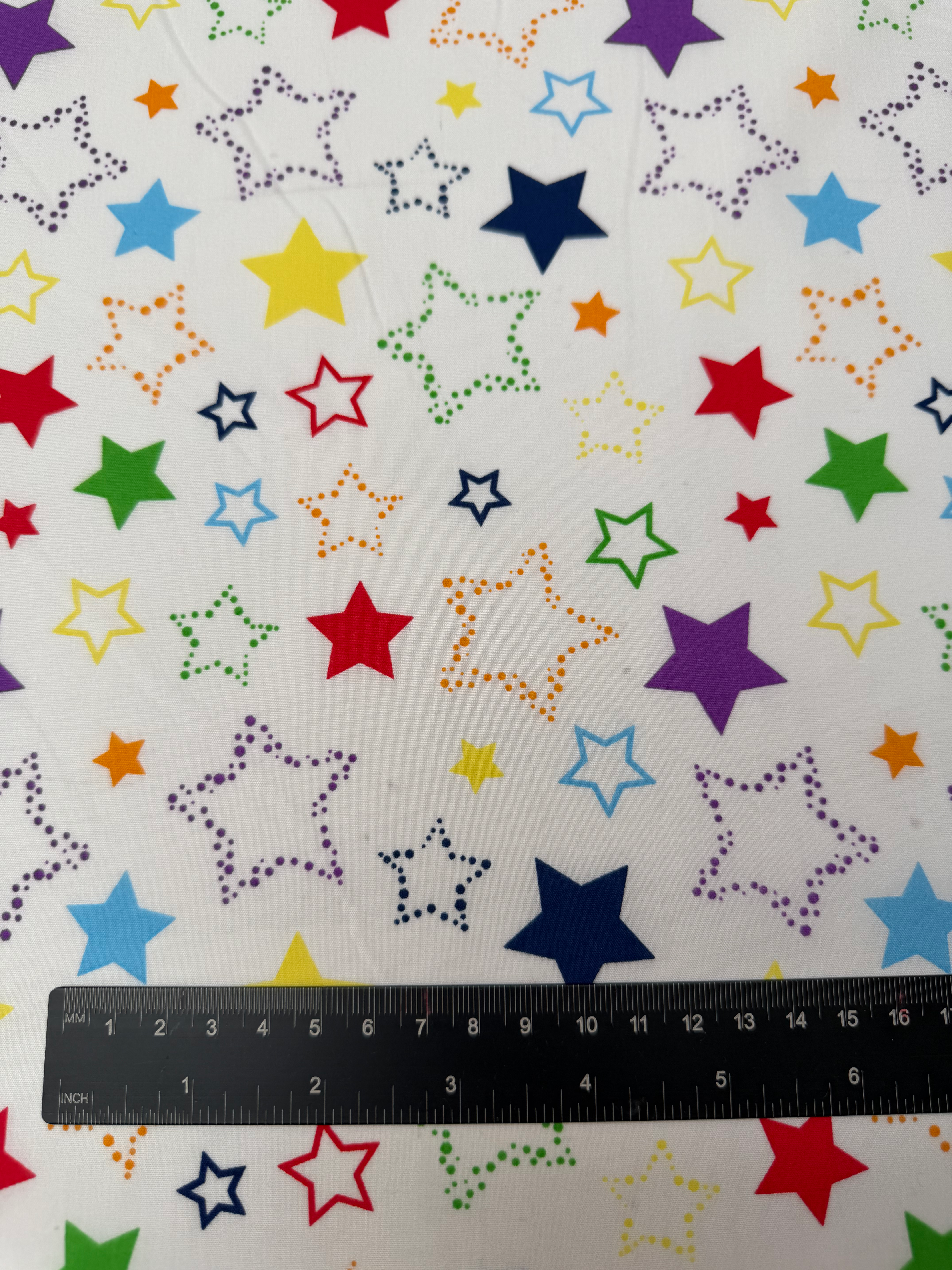 Multi Coloured Stars Polycotton Fabric Ruler view