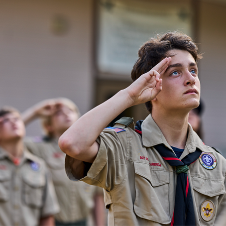 scouts saluting American flag