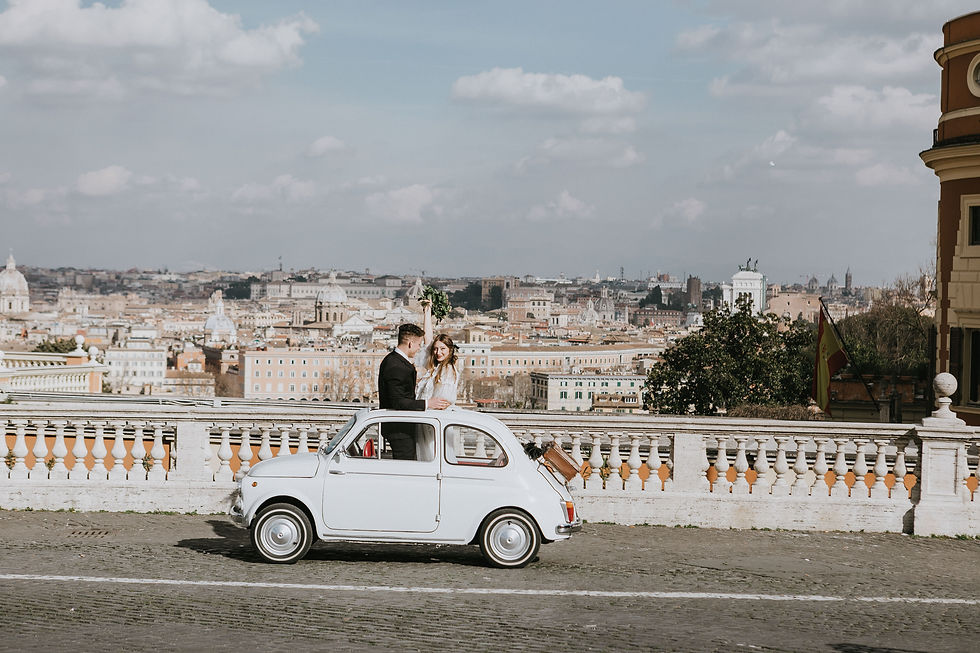 Bride and groom in editorial wedding portraits with vintage Fiat 500 overlooking the Rome skyline from Gianicolo Hill.