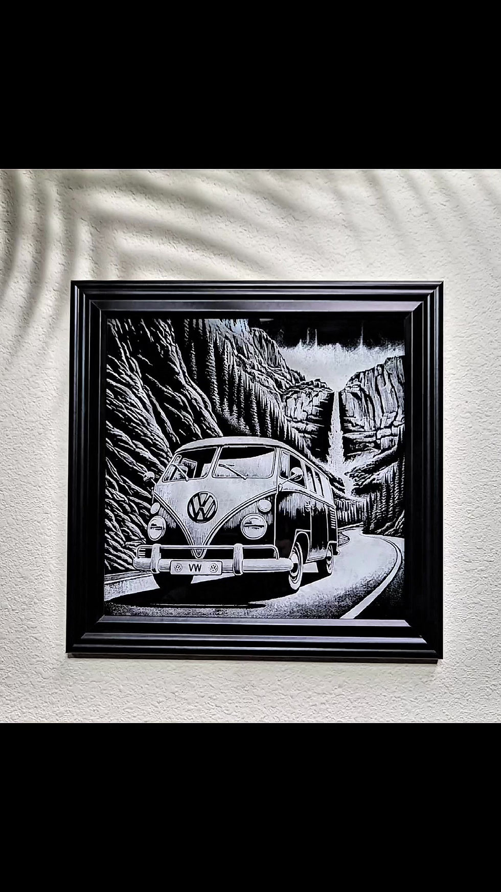 Thumbnail: VW Bus driving through a canyon with a waterfall in a black frame-video