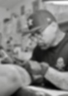 Artist doing a tattoo