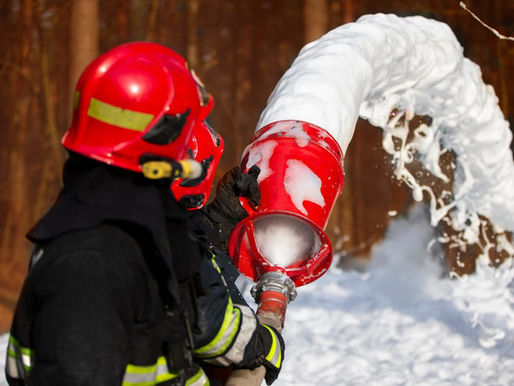Firefighter using firefighter foam