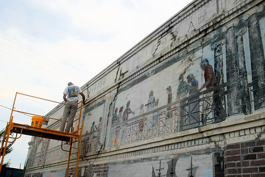 Norton Art restoring The Promenade Mural in Bay St. Louis, MS