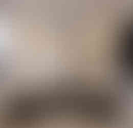 a bathroom with a black sink and black toilet