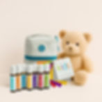 doTERRA Kids Collection mit Roll-ons, Tasche und Teddy auf beige Hintergrund