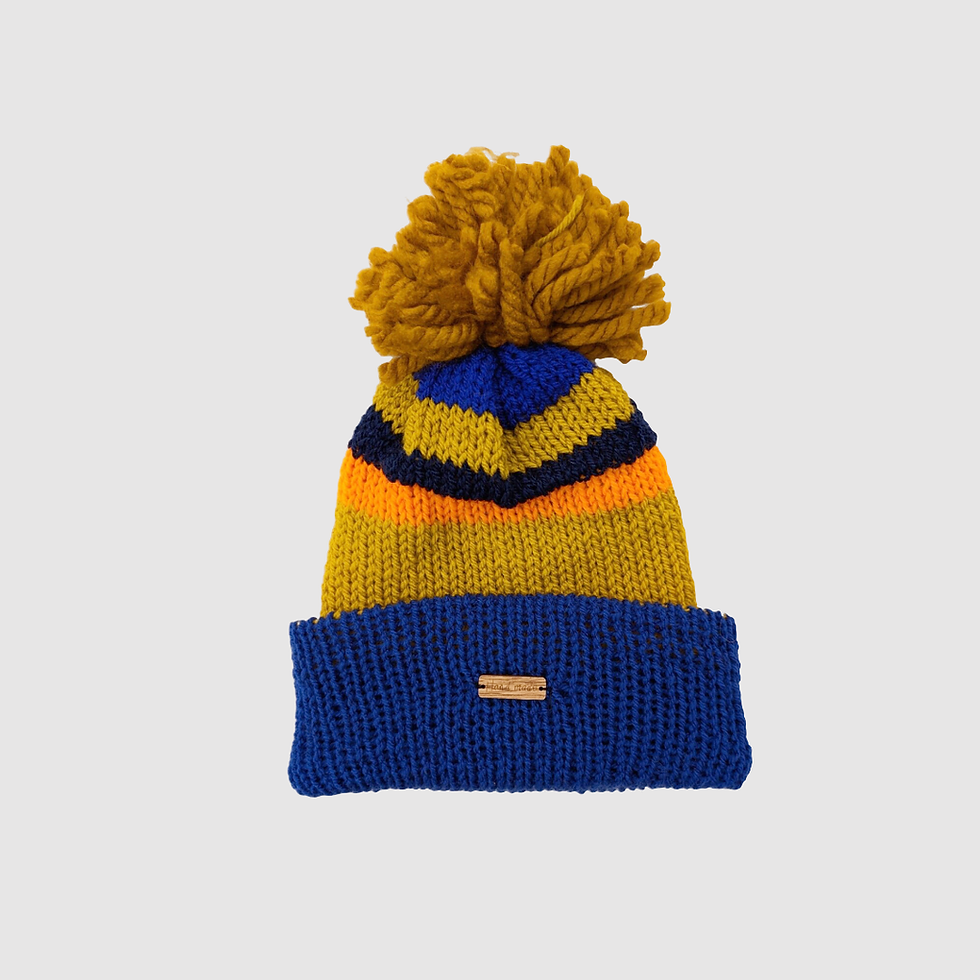 andmade wool hat crafted from recycled wool, featuring unique designs with optional embroidery, playful pom-pom