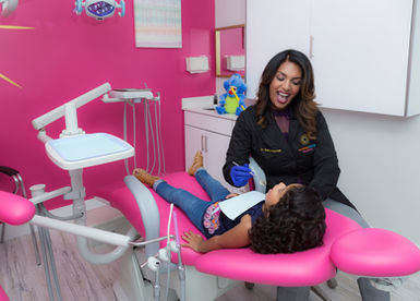 Lifestyle photography showing a dentist at work with kid. Weston FL
