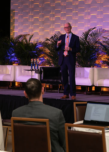 Corporate Event Photography showing keynote speaker and audience South Florida