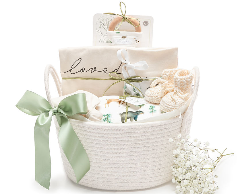 E-commerce product photography of Little Nature Lover Baby clothing displayed in a woven basquet